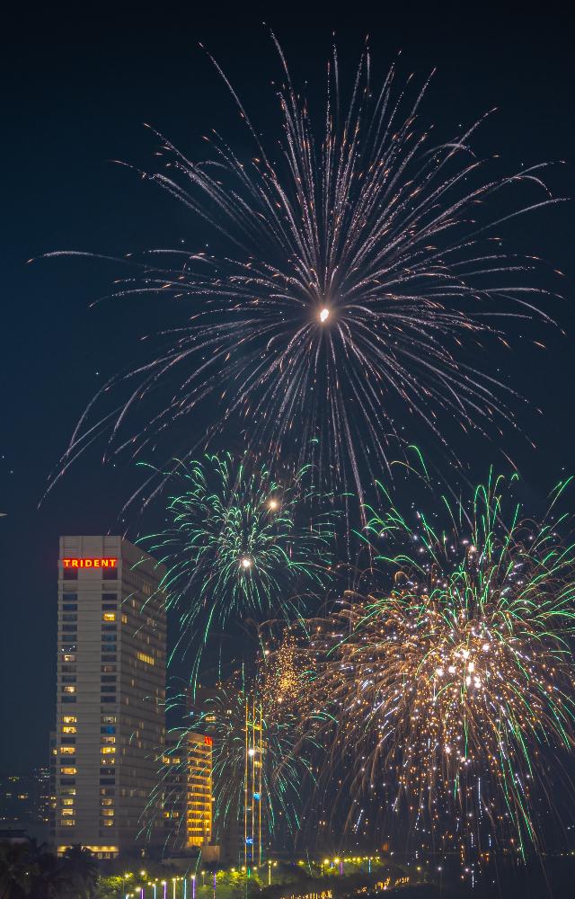 The skyline becomes a canvas of festive brilliance, drawing crowds to witness the breathtaking display