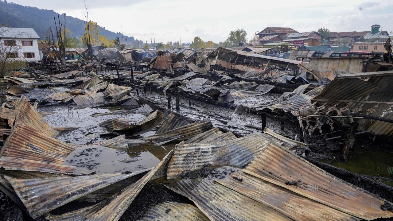 Remains of houseboats after a fire in the tourist hub of Dal Lake, in Srinagar, Saturday, Nov. 11, 2023. PTI Photo