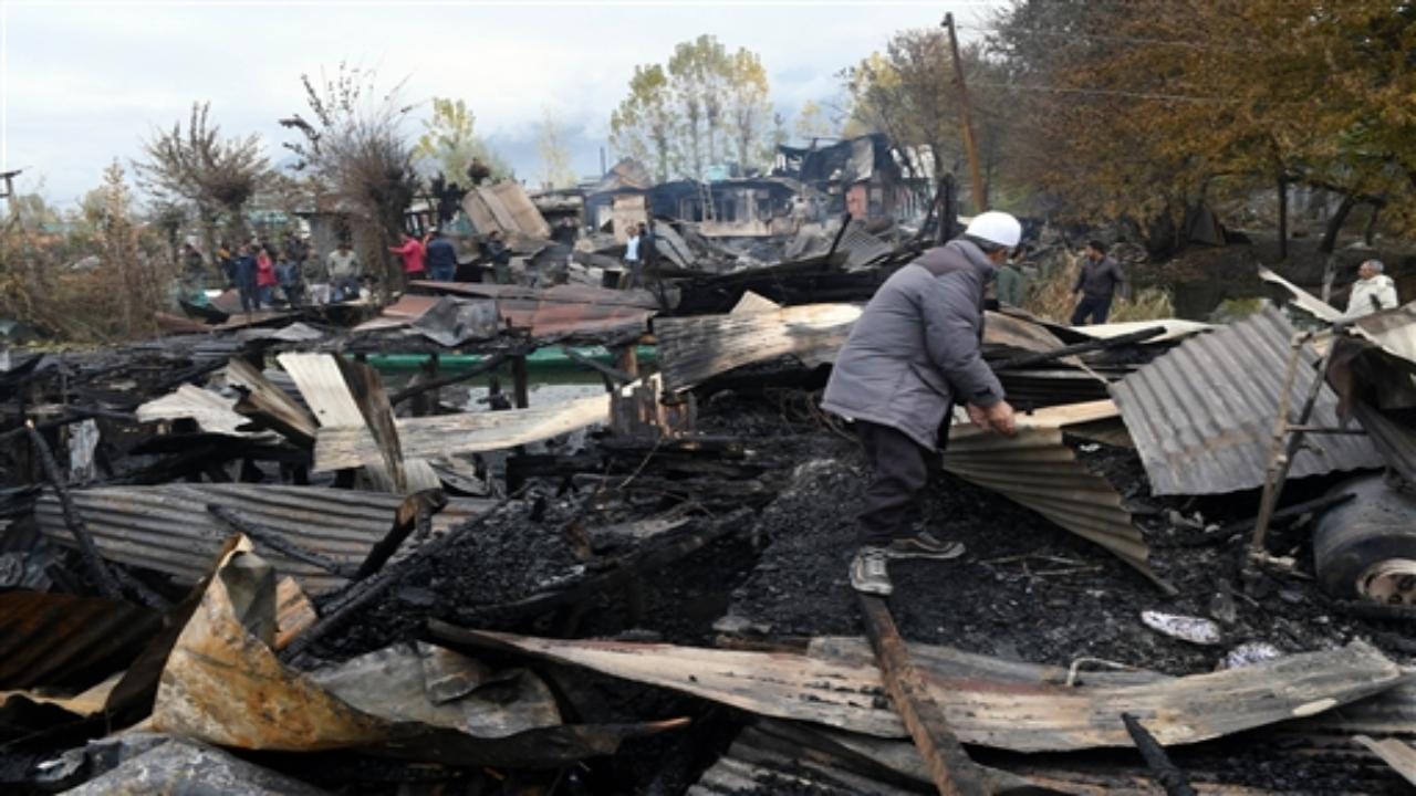 Three tourists from Bangladesh were charred to death in a major blaze in a houseboat on the famous Dal Lake on Saturday