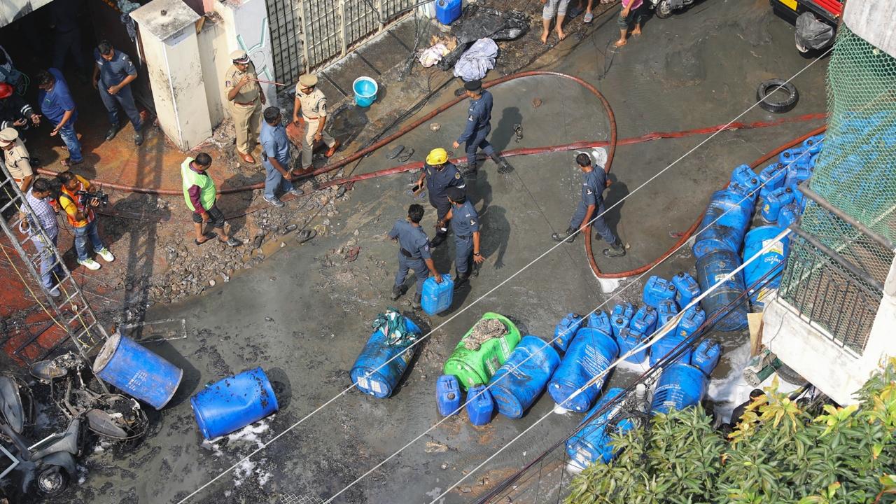 According to police, the blaze erupted on the ground floor of the apartment complex, where some drums containing chemicals were stored and later spread to the first and second floor