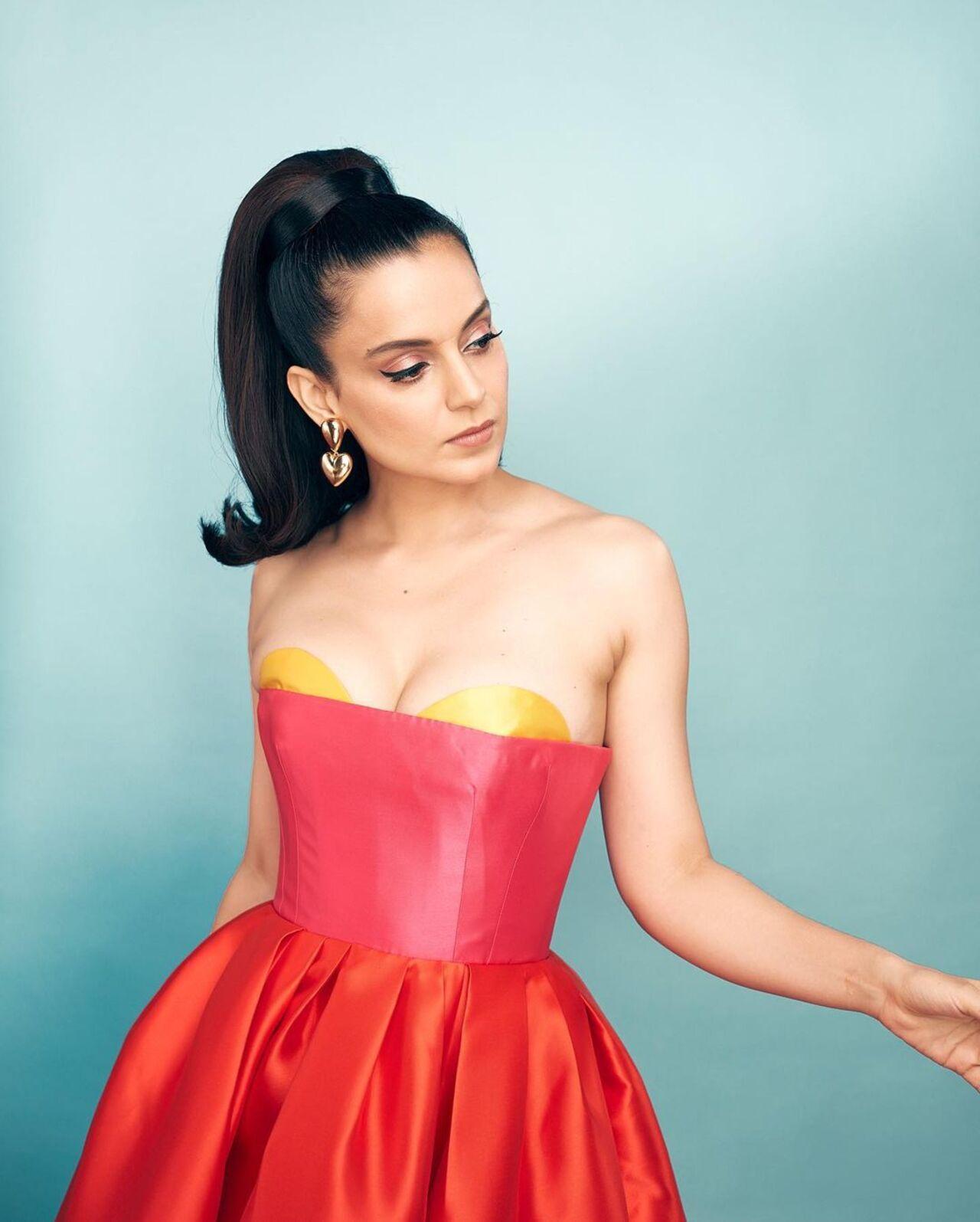 Kangana was dressed in a red, pink and yellow colour-block gown by Gauri & Nainika. She completed the look with a high ponytail and winged eyes
