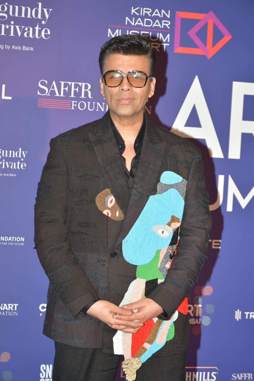 The host, Karan Johar, dazzled in a dapper black suit with some colourful designs on the jacket that added a delightful twist to the ensemble