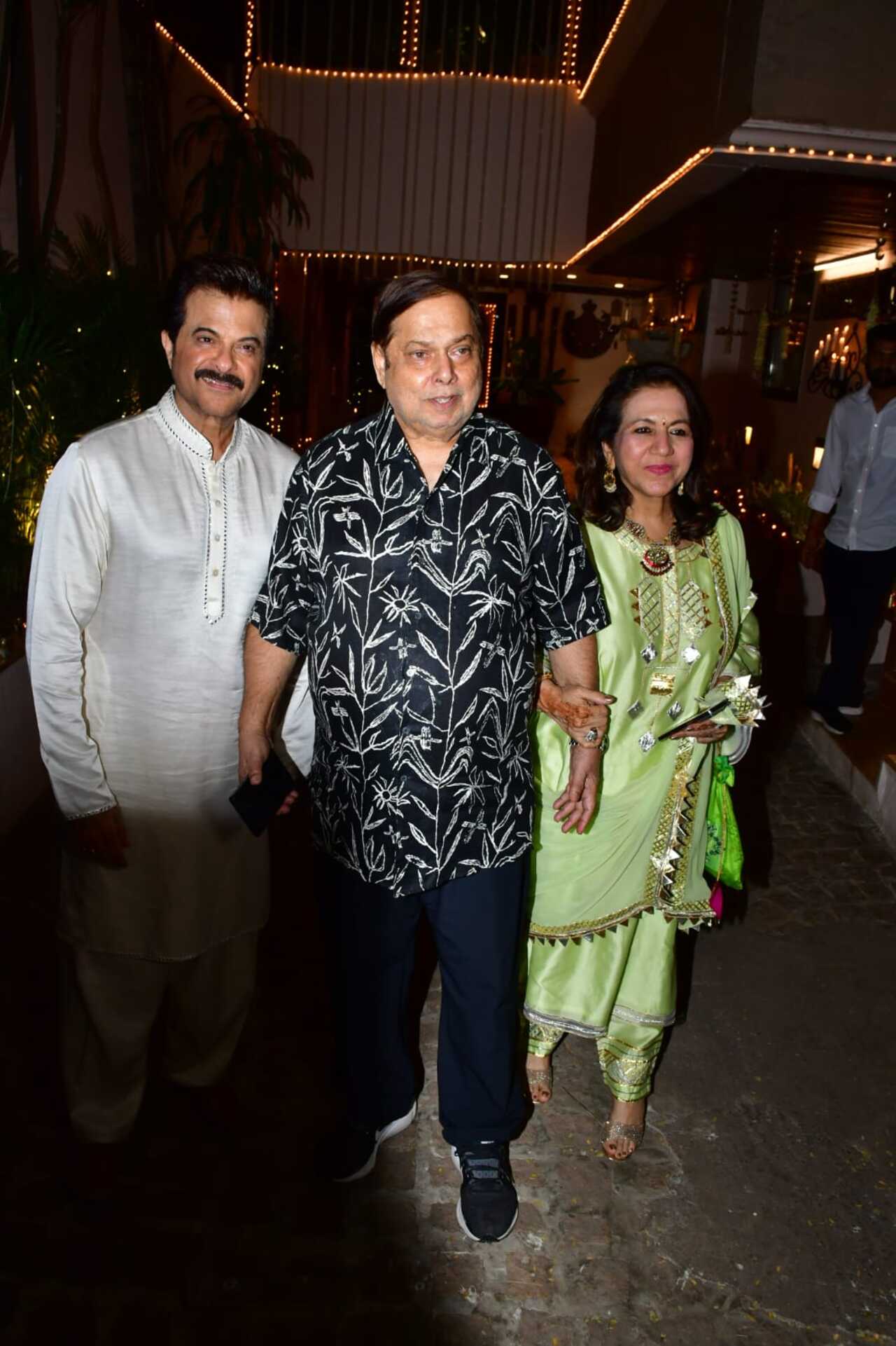 David Dhawan and his wife pose with Anil Kapoor at the latter's residence