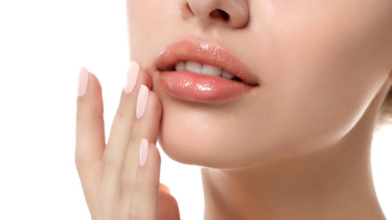 Start by exfoliating your lips to remove any dry, flaky skin. You can gently scrub your lips with a homemade sugar and lemon scrub (1 teaspoon of lemon juice and 2 teaspoons of sugar) or use a soft toothbrush to slough off the dead skin. 