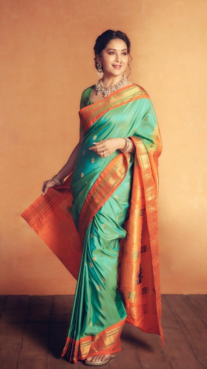 Dressed in a mint green and orange saree, Madhuri looked straight out of a dream. The Maharashtrian touch added by her was like a cherry on the cake