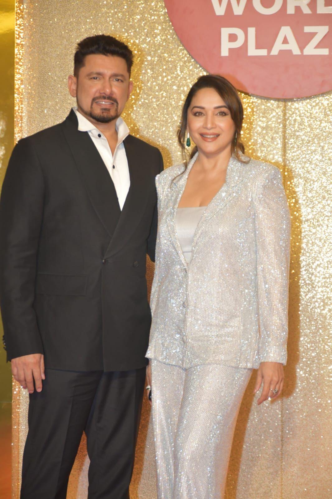 Madhuri Dixit and Dr.Nene attended the event last night. Dr,.Nene was dressed in a sharp suit while Madhuri was a shimmery vision