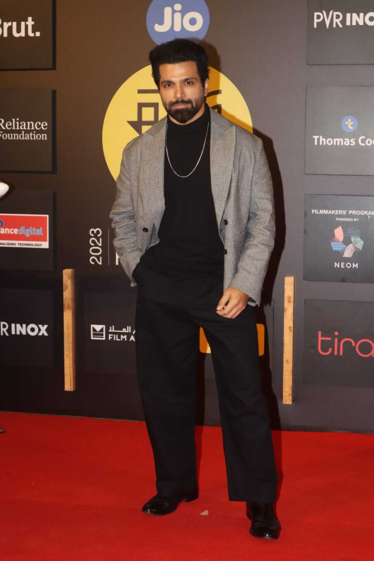 Rithvik Dhanjani looked dapper in black turtle neck t-shirt, loose trousers and a grey blazer