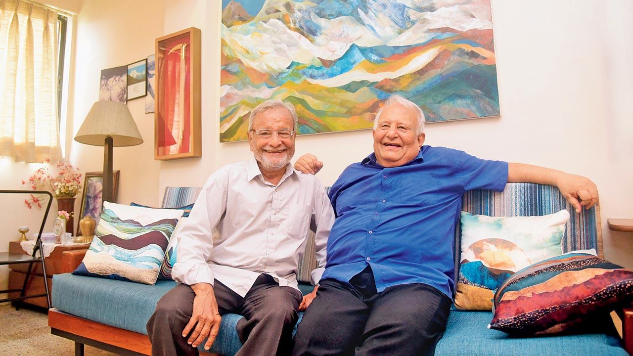 Vijay Kothari and Harish Kapadia in the latter’s home; seen in the background are Geeta Kapadia’s paintings of mountain views from Mussoorie and a portrait of their son, the late Lt Nawang Kapadia. Pics/Shadab Khan