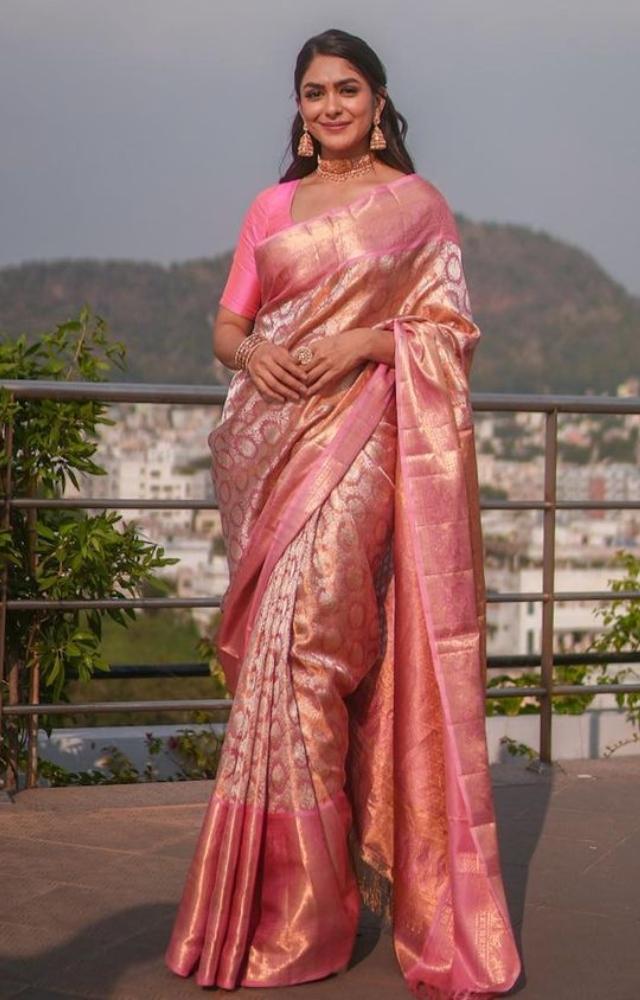 Mrunal Thakur gave yet another bookmark-worthy look. She looked pretty in a pink saree and paired it with a matching blouse