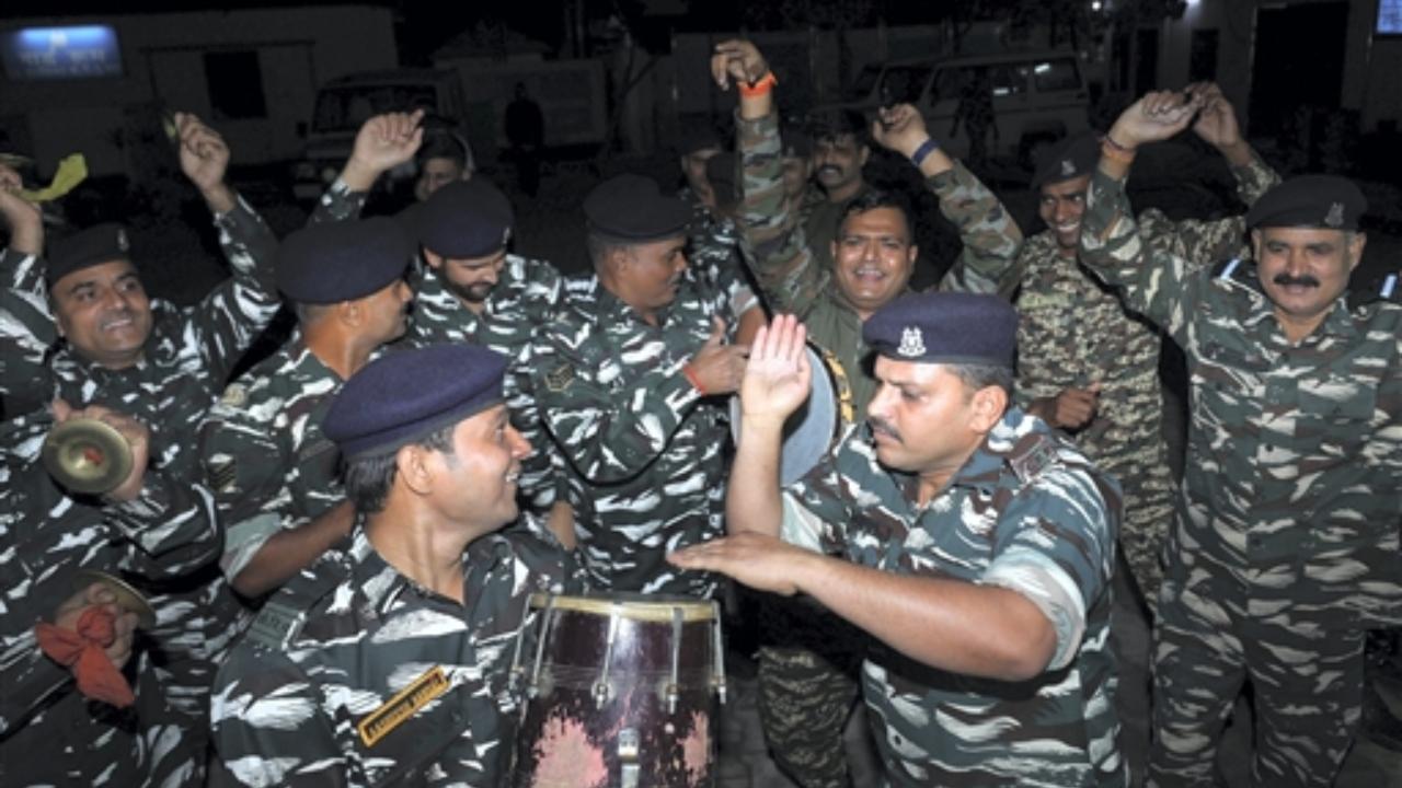 Central Reserve Police force (CRPF) personnel dance as they celebrate Diwali, on outskirts of Jammu