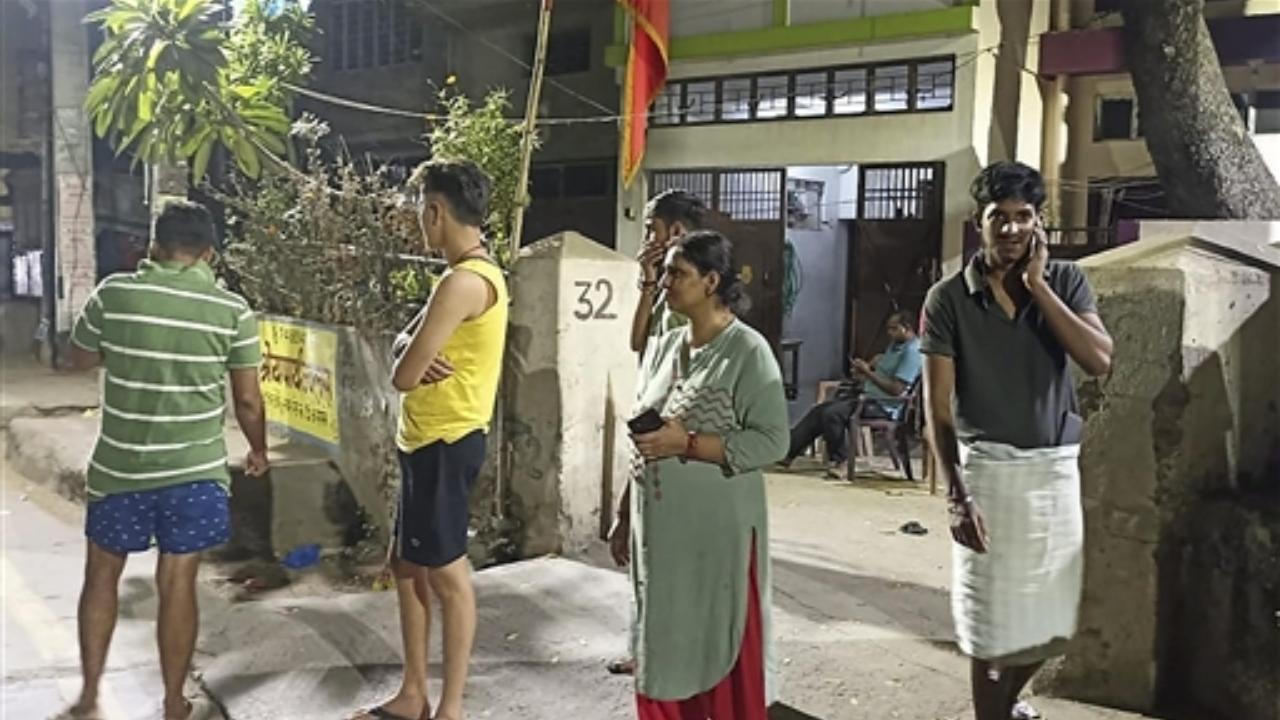 People gather outside their offices after tremors were felt due to an earthquake, in Patna, Friday night, Nov 3, 2023. A 6.4-magnitude earthquake hit Nepal at 11:32 pm IST, according to National Center for Seismology (Pic/PTI)