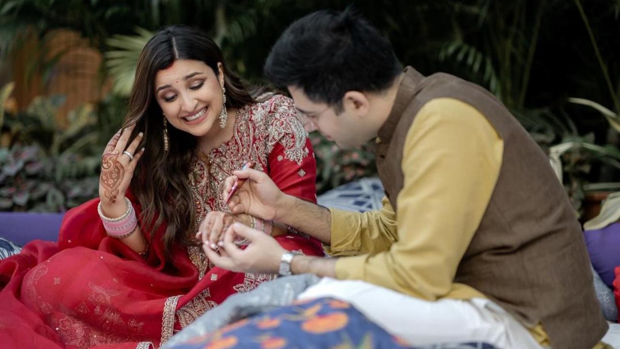 Parineeti opted for a heavily embroidered red suit for her first Karwa Chauth with husband Raghav Chadha. Raghav, on the other hand, opted for a yellow kurta with a brown Nehru jacket and white salwar