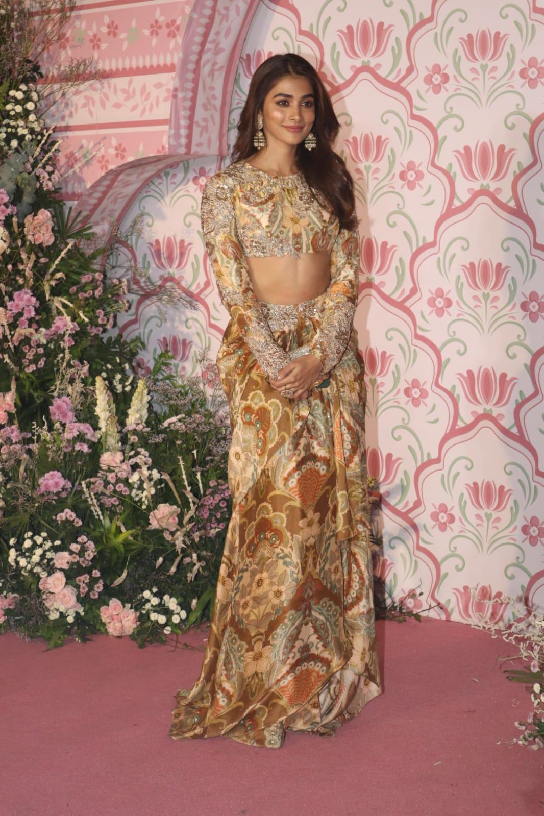 Pooja Hegde upped the glam quotient in this two-piece stylish gold lehenga