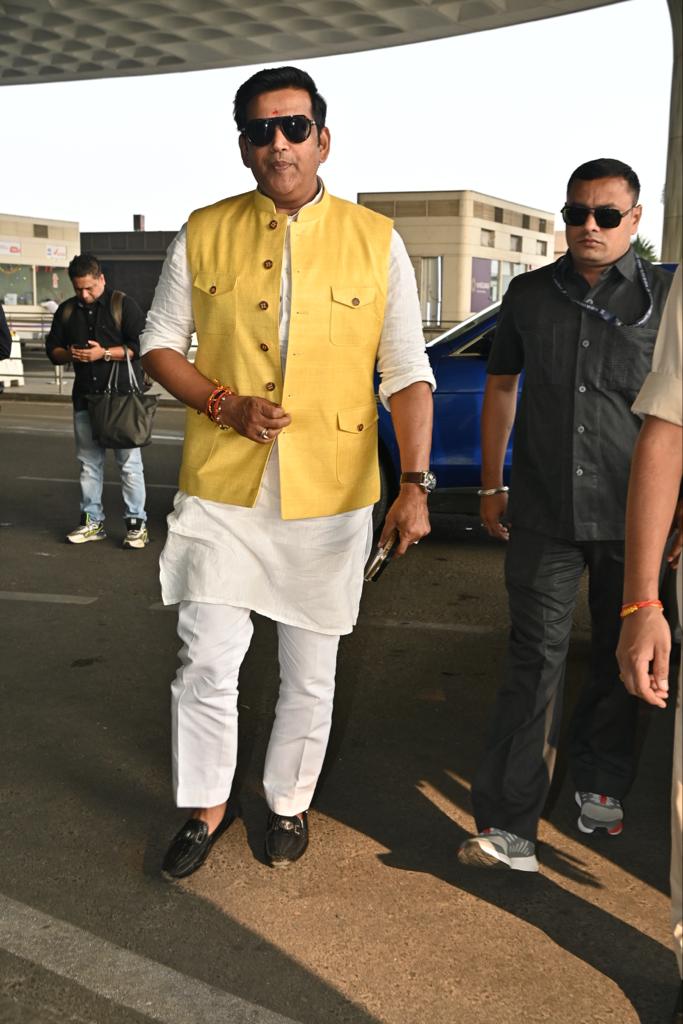Ravi Kishan aced his airport look in white kurta pyjama paired with yellow Nehru Jacket