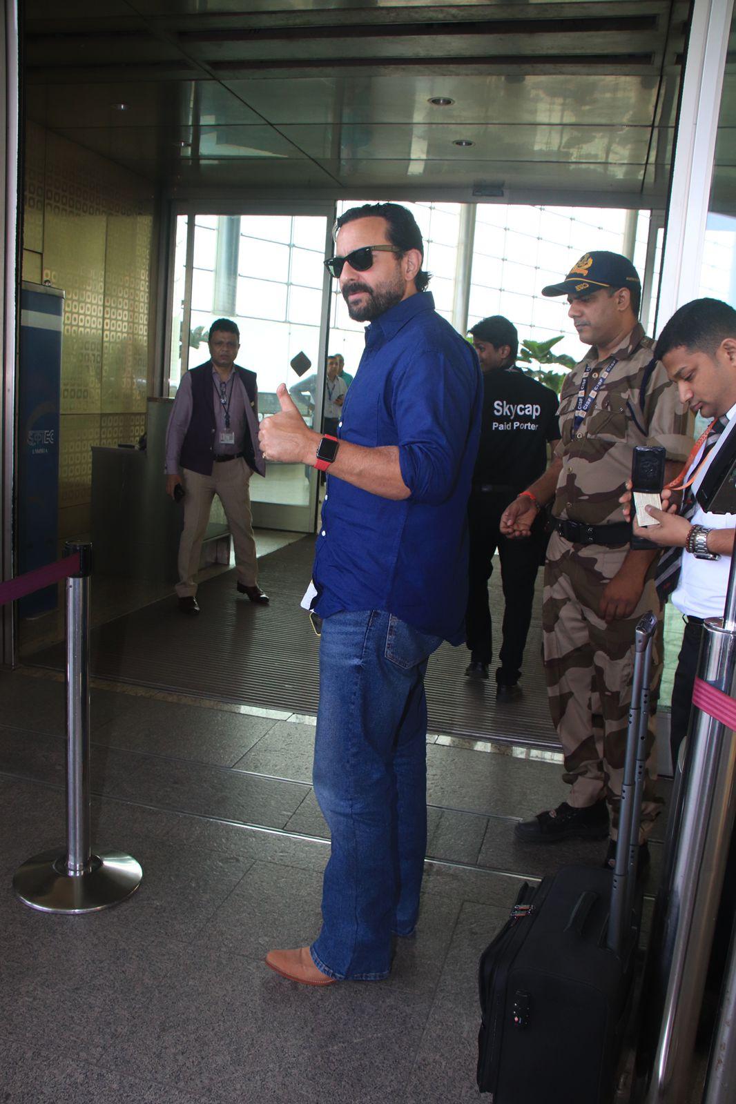 Saif Ali Khan wore a blue shirt and matching jeans for his airport look