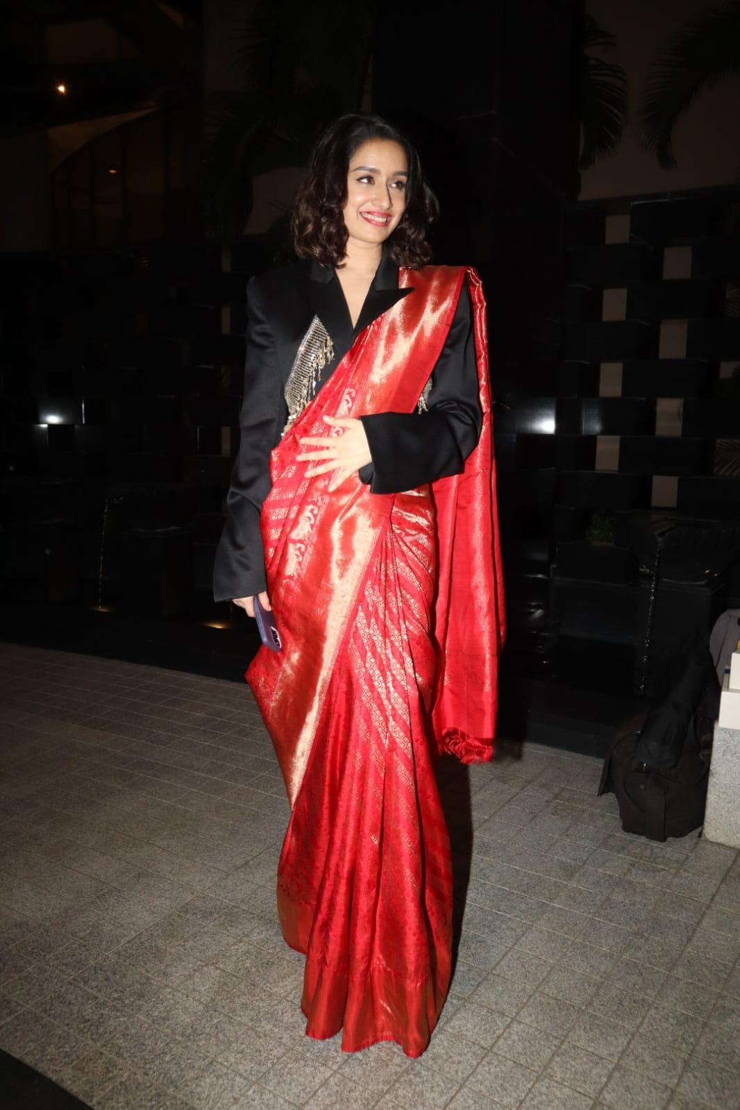 Shraddha Kapoor attended the opening of the Jio World Plaza in a red saree paired with a contrasting black blouse