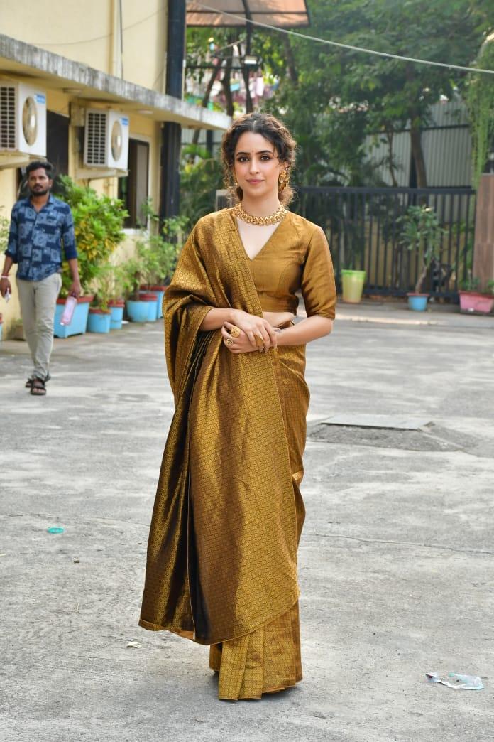 Sanya Malhotra looked stunning in a golden saree as she went out to promote her upcoming film Sam Bahadur
