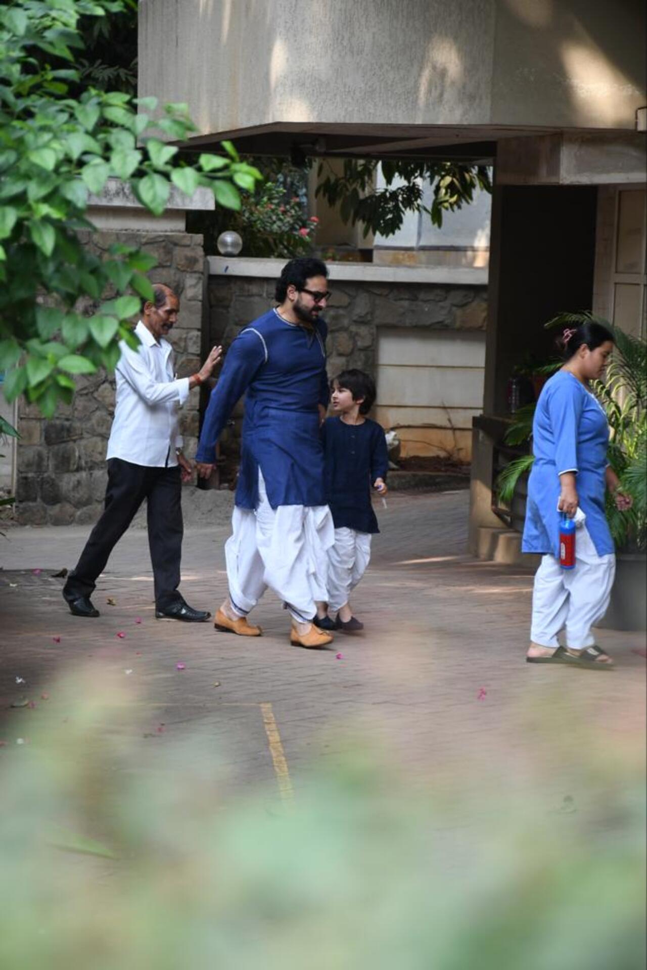 Saif Ali Khan looked dapper in a blue kurta and white dhoti. His kids also wore traditional wear of the same colour for Diwali puja