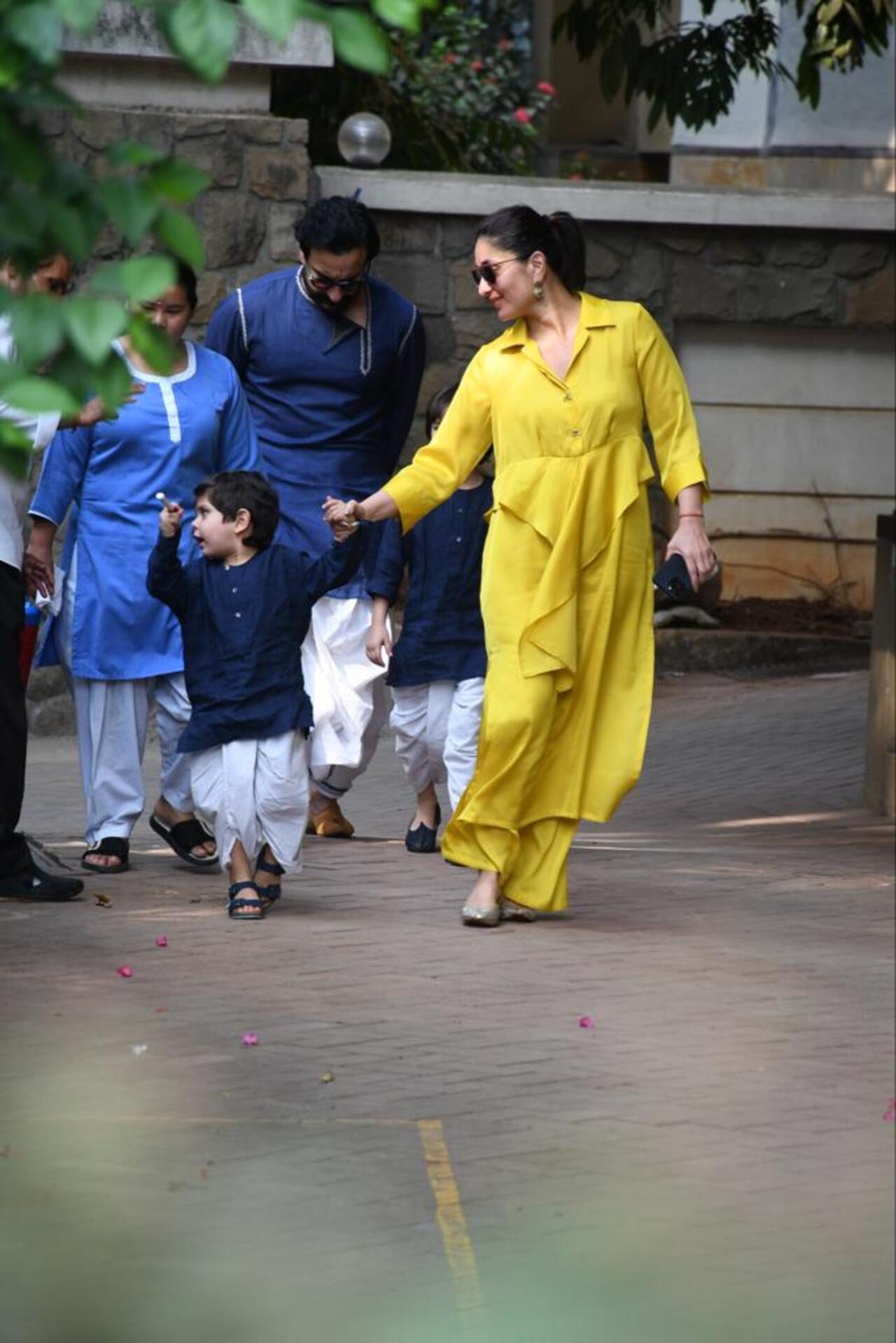 Kareena Kapoor looked bright in a yellow kurta as she tried to calm down a restless and enthusiastic Jeh