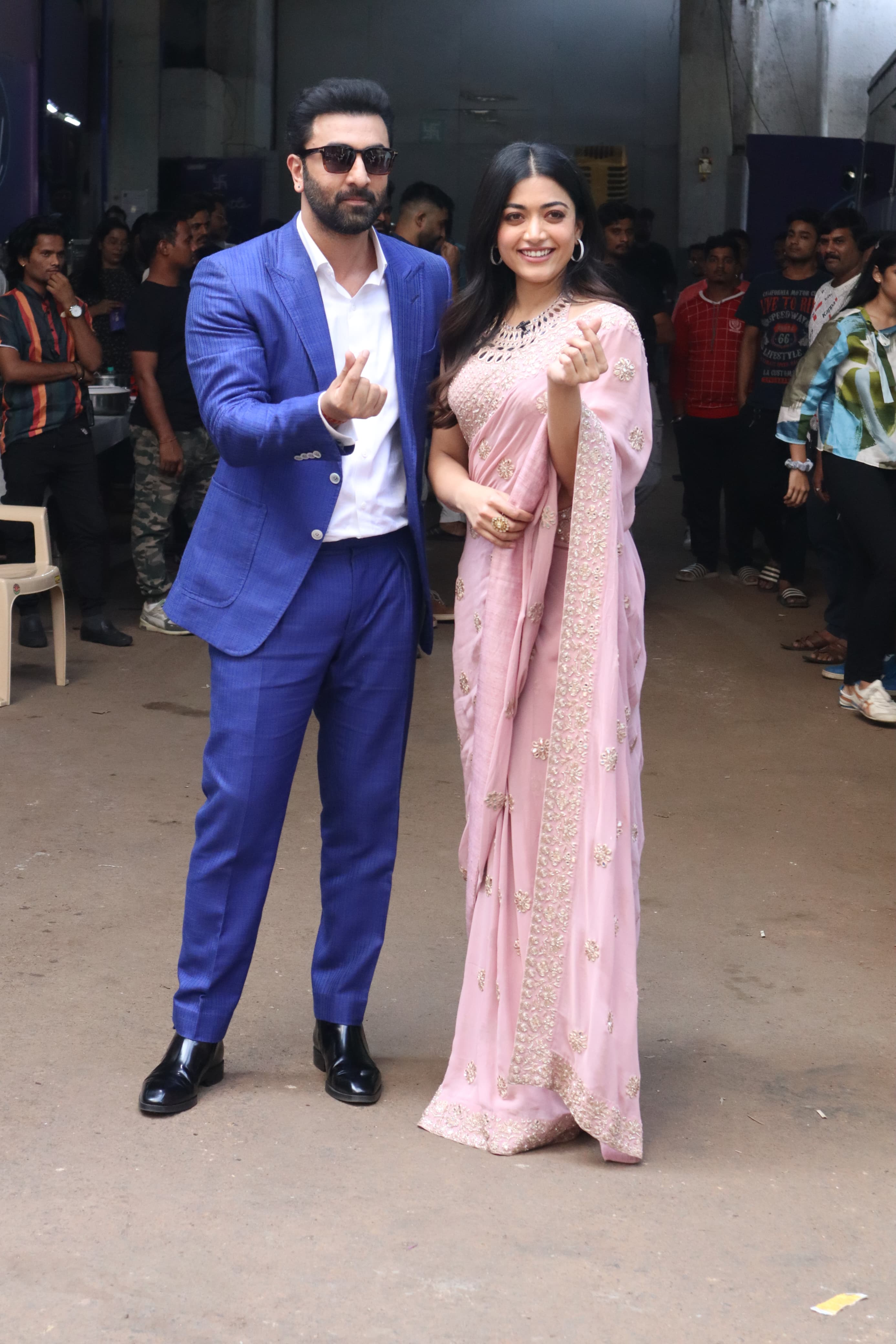 Ranbir Kapoor was clicked wearing a blue suit while Rashmika Mandanna aced her traditional look  in pink six yards as they were clicked promoting Animal