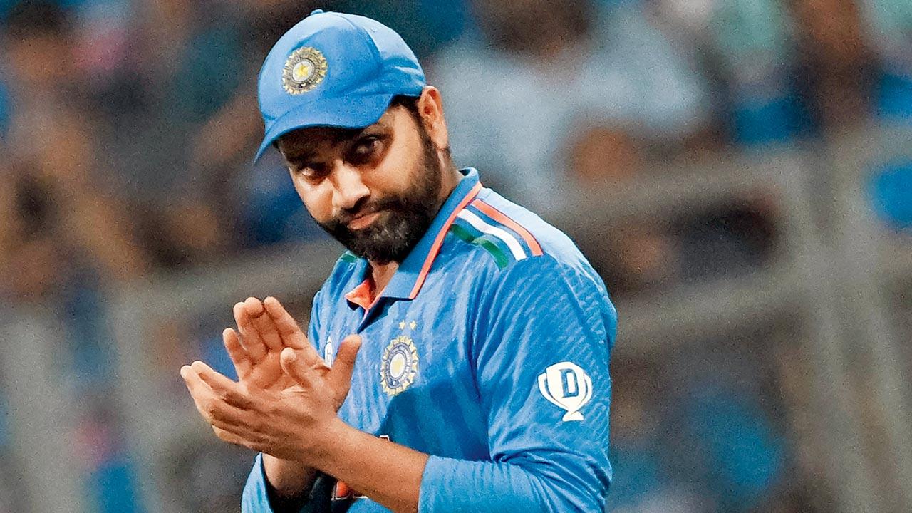 India skipper Rohit Sharma applauds during the semi-final against NZ at Wankhede on Wednesday. Pic/AFP