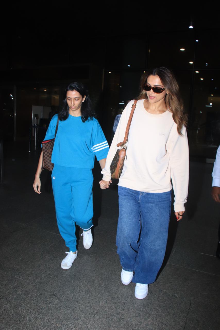 Deepika Padukone looked uber cool in a white sweatshirt and blue jeans, as she was spotted at the airport