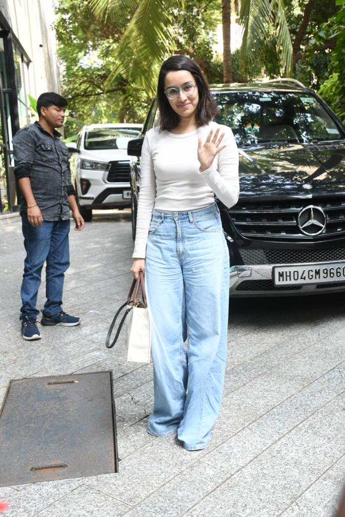 Shraddha Kapoor looked adorable in a white crop top and blue jeans as she greeted the paparazzi