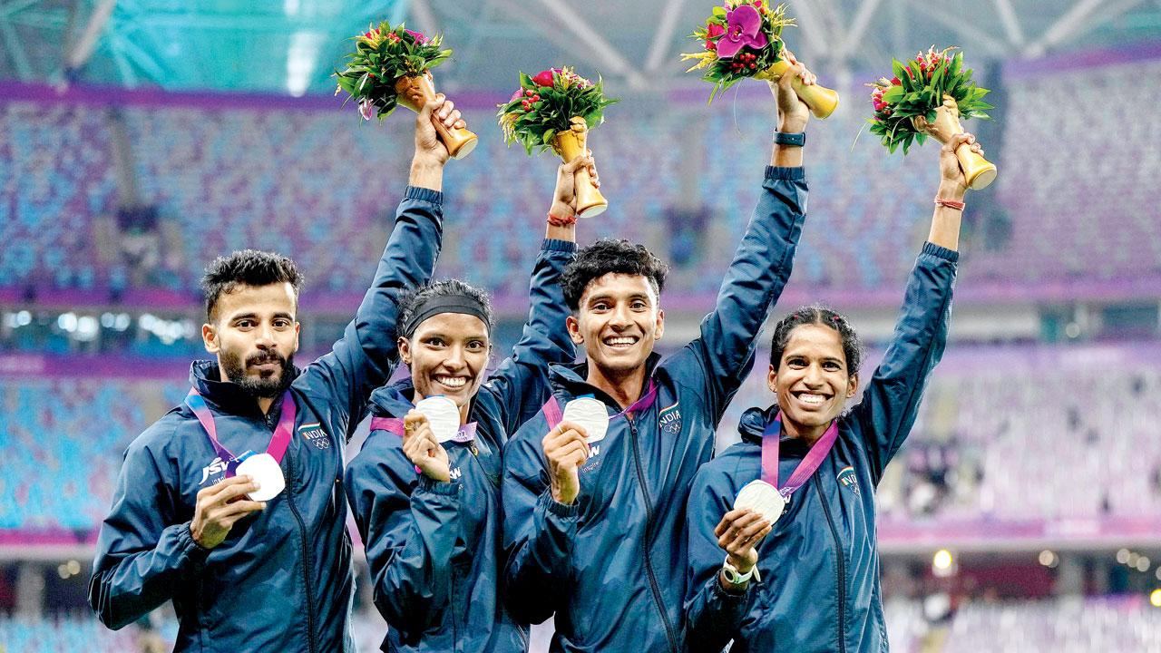 India’s Muhammed Ajmal Variyathodi, Subha Venkatesan, Rajesh Ramesh and Vithya Ramraj with their silver medals in the 4x400m mixed relay yesterday