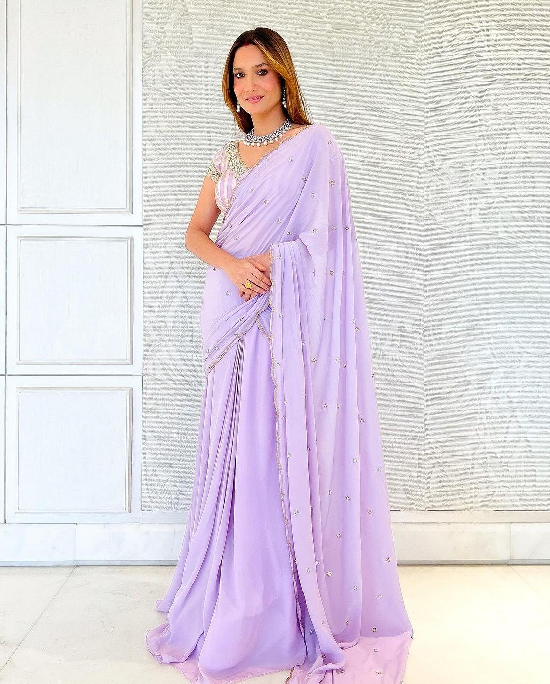 In this particular outfit, Ankita donned a plain, elegant purple saree, complemented by her flowing, open hair and understated makeup