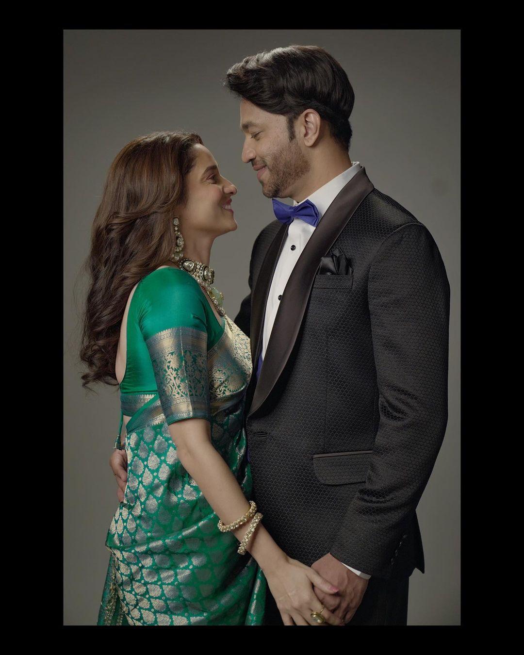 In this picture, Ankita Lokhande poses with her husband, Vicky Jain, while donning a stunning green saree paired with a matching blouse. The actress exudes elegance in this look