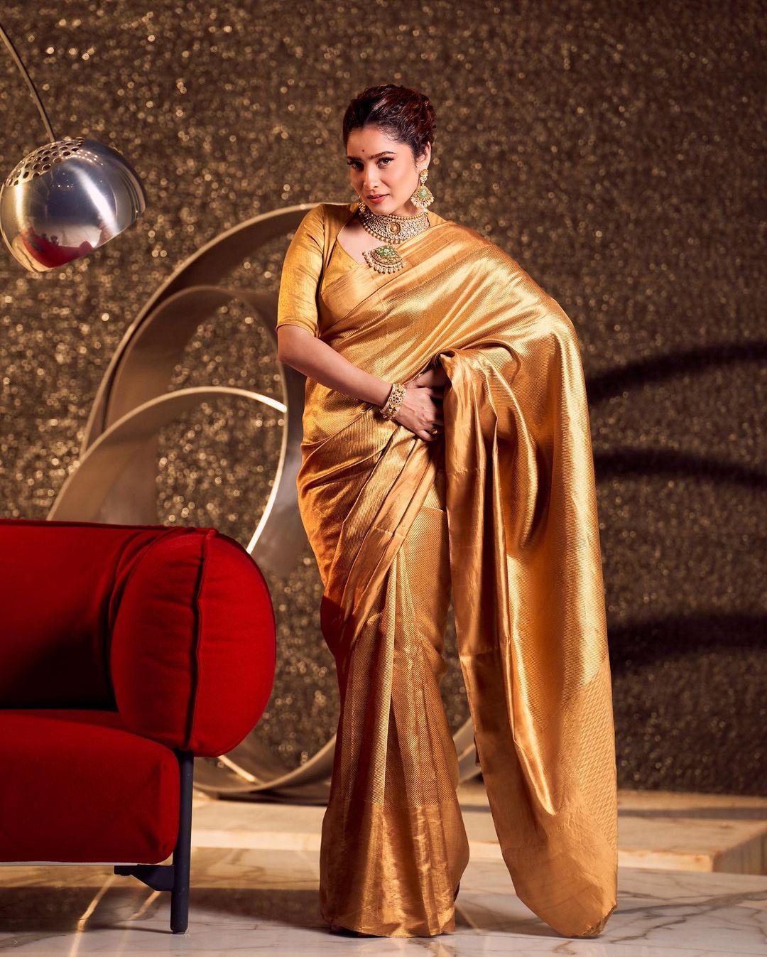 The golden saree is a timeless choice that can never go wrong. Ankita's breathtaking golden saree, paired with a matching blouse, transformed her into a regal queen. Her choice of bold earrings not only added a touch of elegance but also elevated the contours of her face