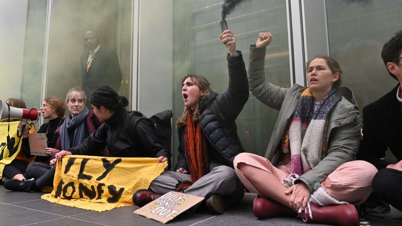 London: Climate activists stage protest outside Barclays office in Canary Wharf