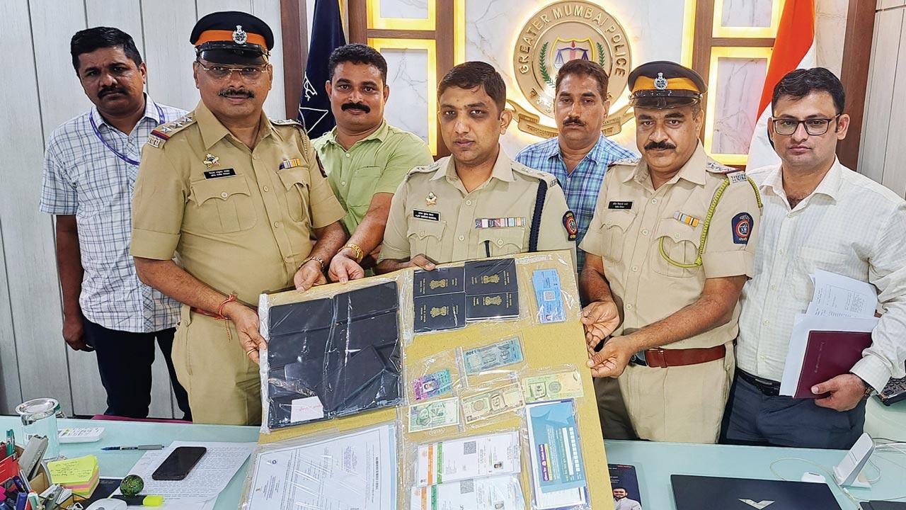 Cops with the items seized from the accused