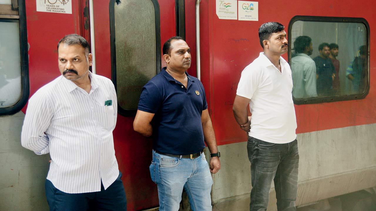 Cops guard the B5 compartment of the Jaipur-Mumbai passenger train, the scene of the massacre. File Pic/Pradeep Dhivar