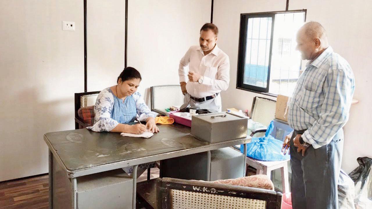 A health official at one of the temporary cabins that has started functioning as a dispensary for the residents. Pic/Courtesy Hemangi Worlikar