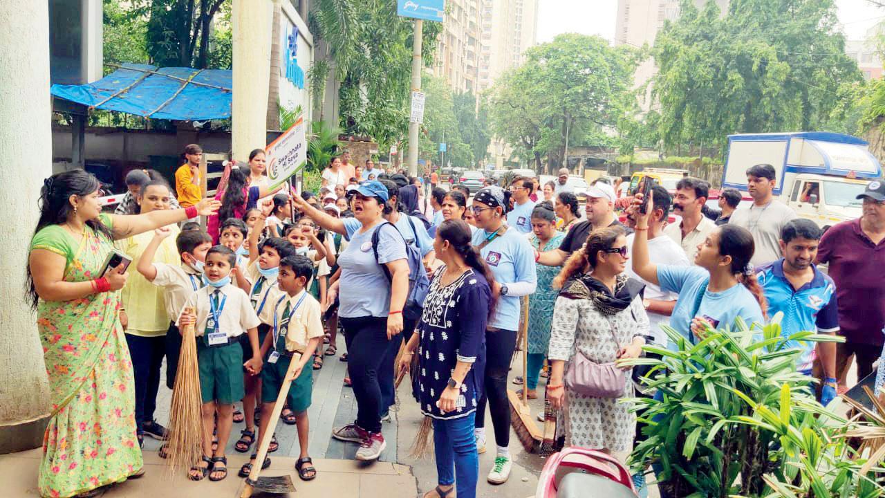 School children participate in a cleanliness drive organised in Marol