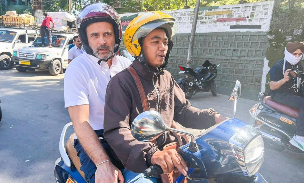 In Photos: Rahul Gandhi rides pillion on scooter to meet former Mizoram CM
