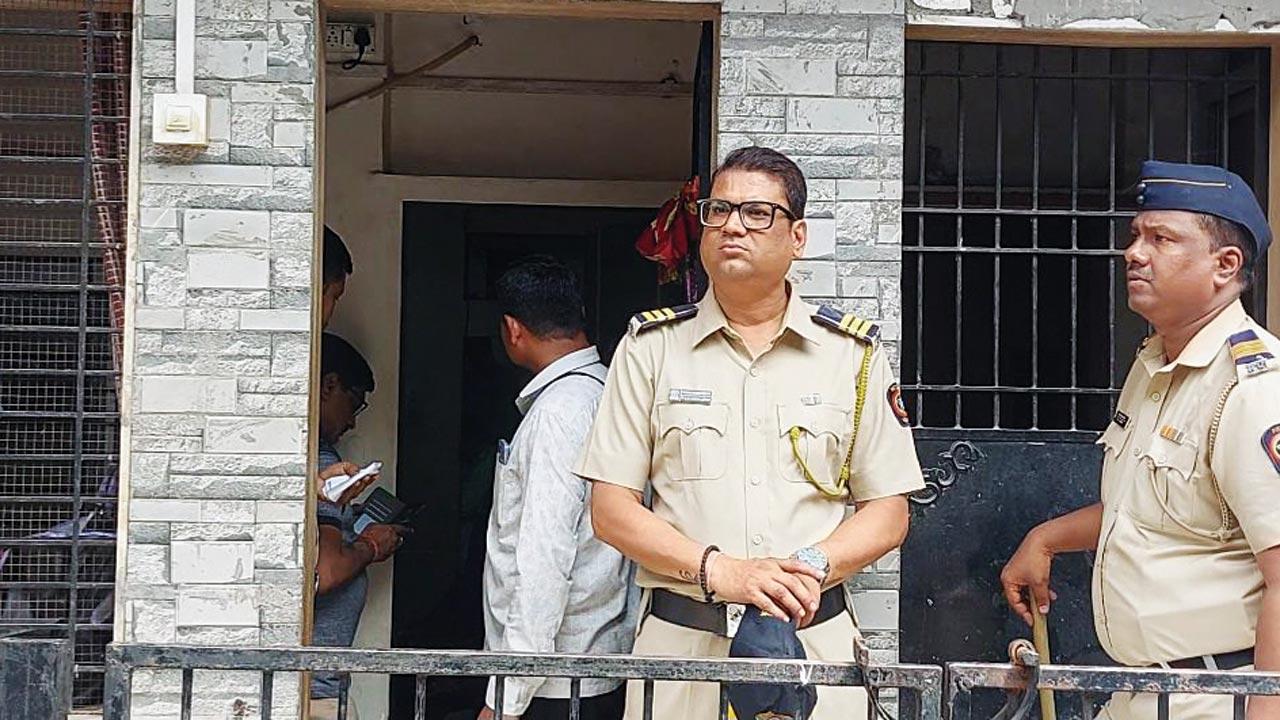 Cops outside Abdul Wahid Shaikh’s residence in Vikhroli early Wednesday morning. Pic/Rajesh Gupta