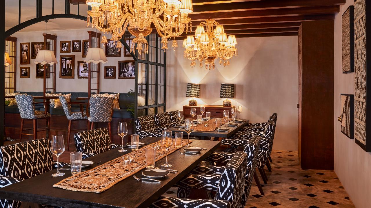 The 150-seater space features a mix of long communal tables, plush sofas, an island bar and two intimate private dining spaces—The Eliot Room and The Jade Room. 
