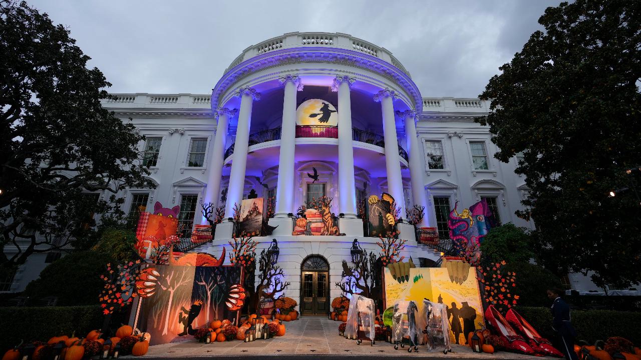 The White House is lit for Halloween before President Joe Biden and first lady Jill Biden give treats to trick-or-treaters on the South Lawn of the White House, on Halloween.