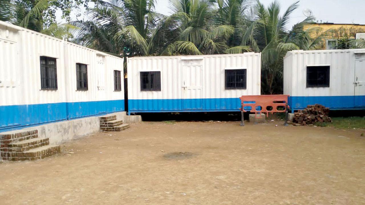 Containers near the site of the demolished dispensary. A temporary facility has not been created yet