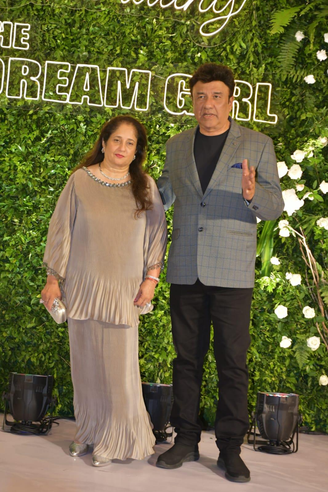 Anu Malik was snapped alongside his wife at Hema Malini's 75th