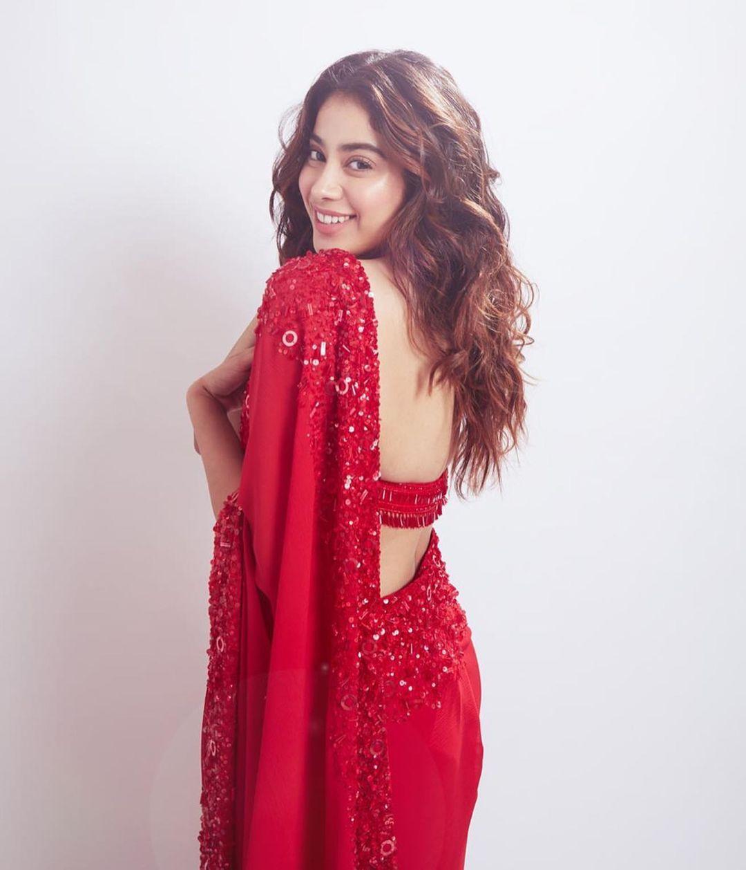 Janhvi Kapoor's choice of a sultry red Manish Malhotra saree and blouse set couldn't be more perfect for Diwali