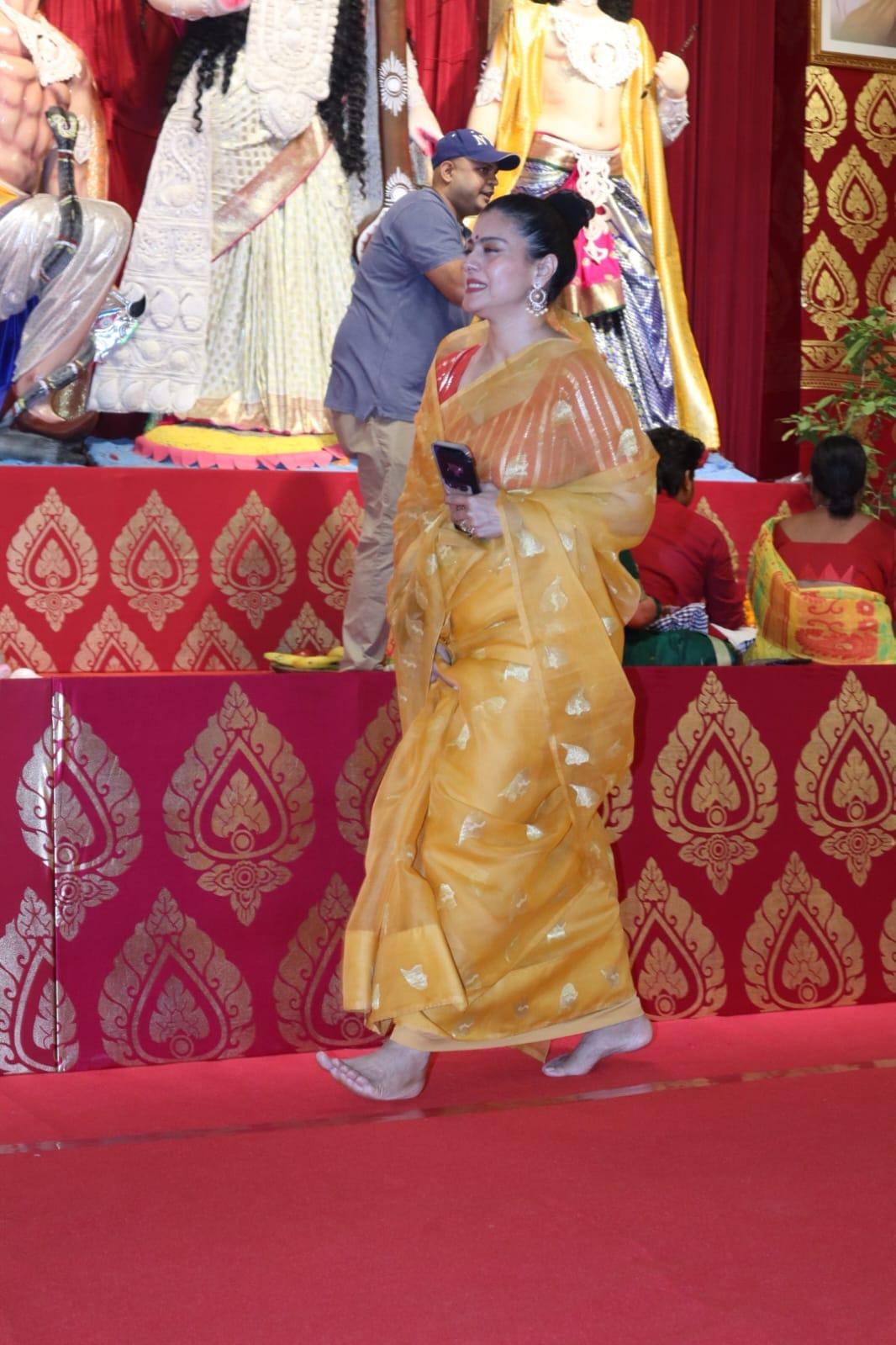 Kajol looked absolutely beautiful in a yellow saree as she was snapped at the Durga Pooja pandal in Juhu