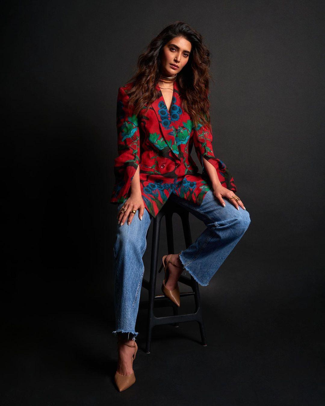 Matching colours effectively is indeed an art, and Karishma's look provides some valuable inspiration in this regard. She made a striking fashion statement by pairing a stunning red and green blazer with blue jeans, showcasing her keen sense of style and color coordination