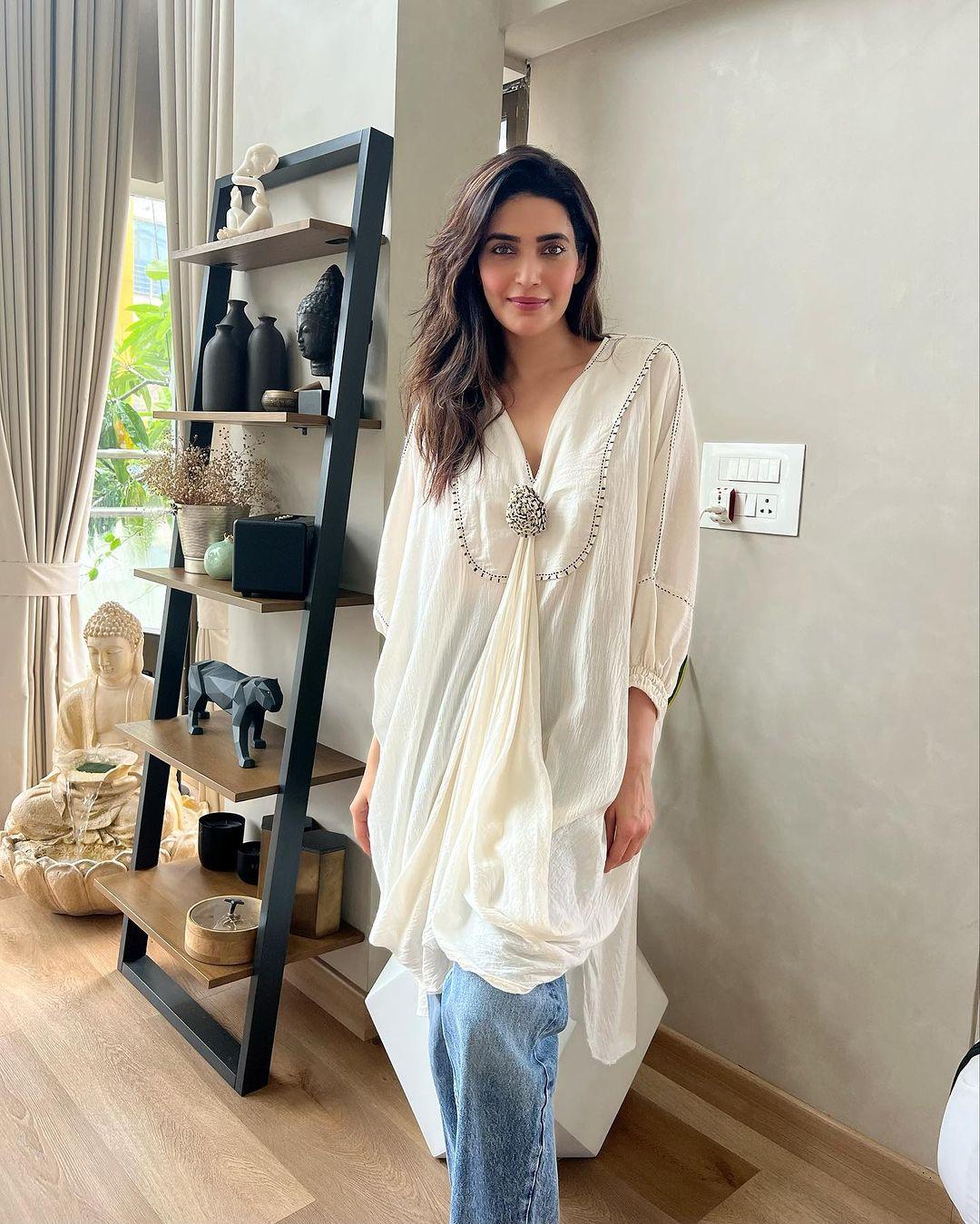 What particularly caught our attention is the stylish oxidized brooch, which adds a delightful Indo-Western touch to the ensemble. Karishma Tanna's fashion sense is truly on point, blending traditional and contemporary elements effortlessly