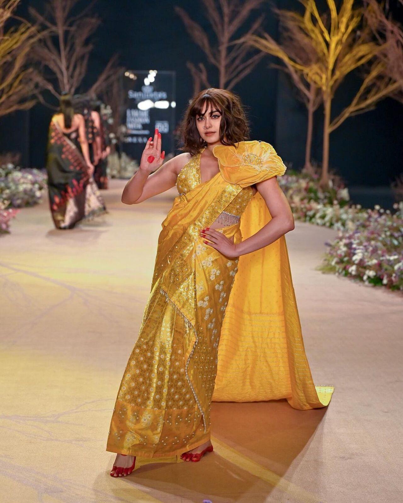 Adah Sharma poses in a striking yellow saree