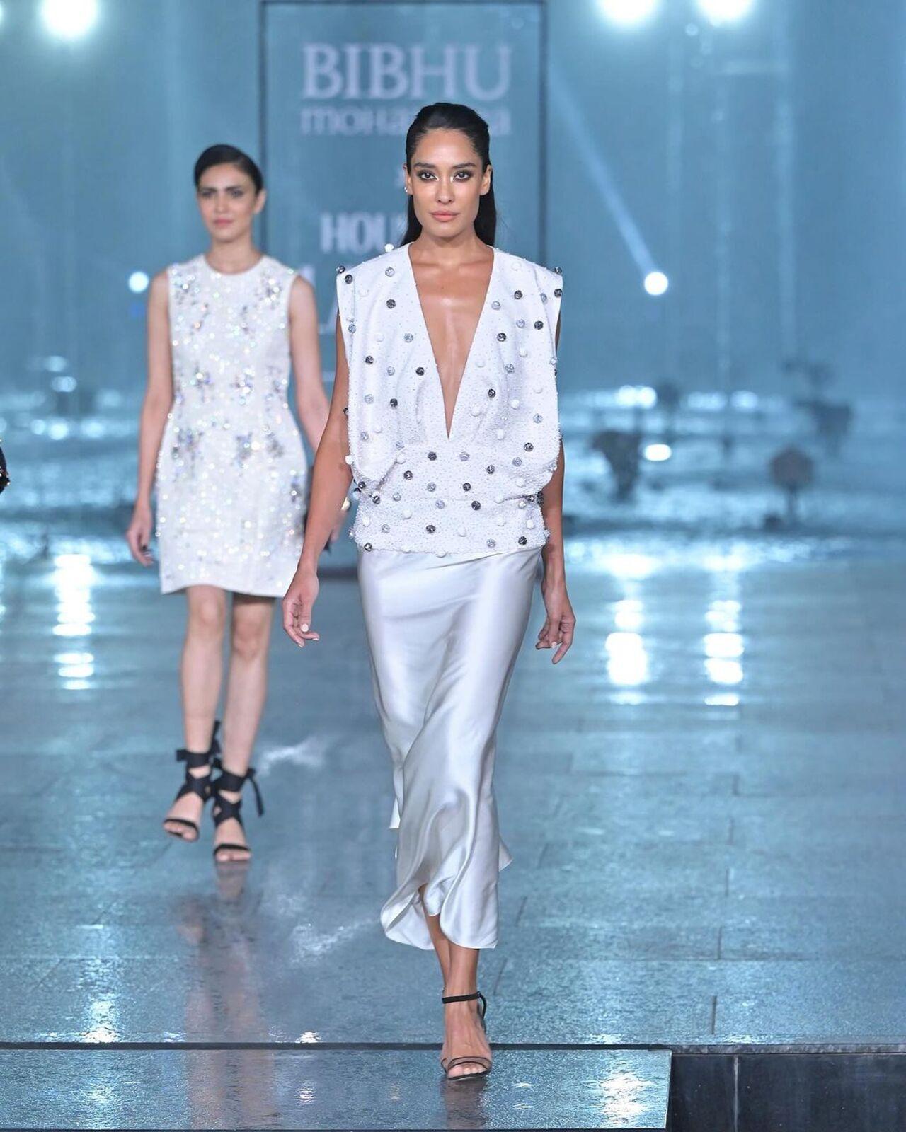Lisa Haydon aced in this white silk skirt paired with a deep-neck white top