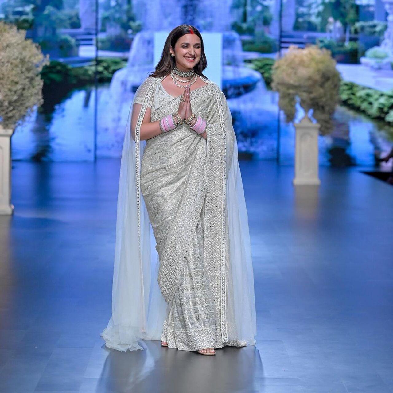 Parineeti Chopra walked the ramp for the first time after her wedding. She looked gorgeous in a pearl white saree with a long veil