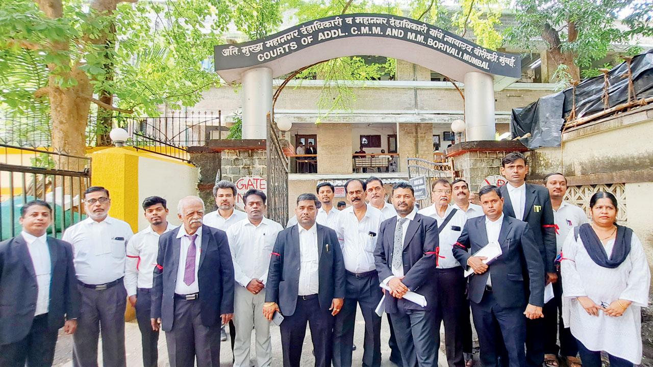 Lawyers protested the alleged attack on Sayed on Tuesday with red ribbons tied on their arms